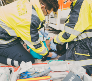 First responders helping an accident victim.