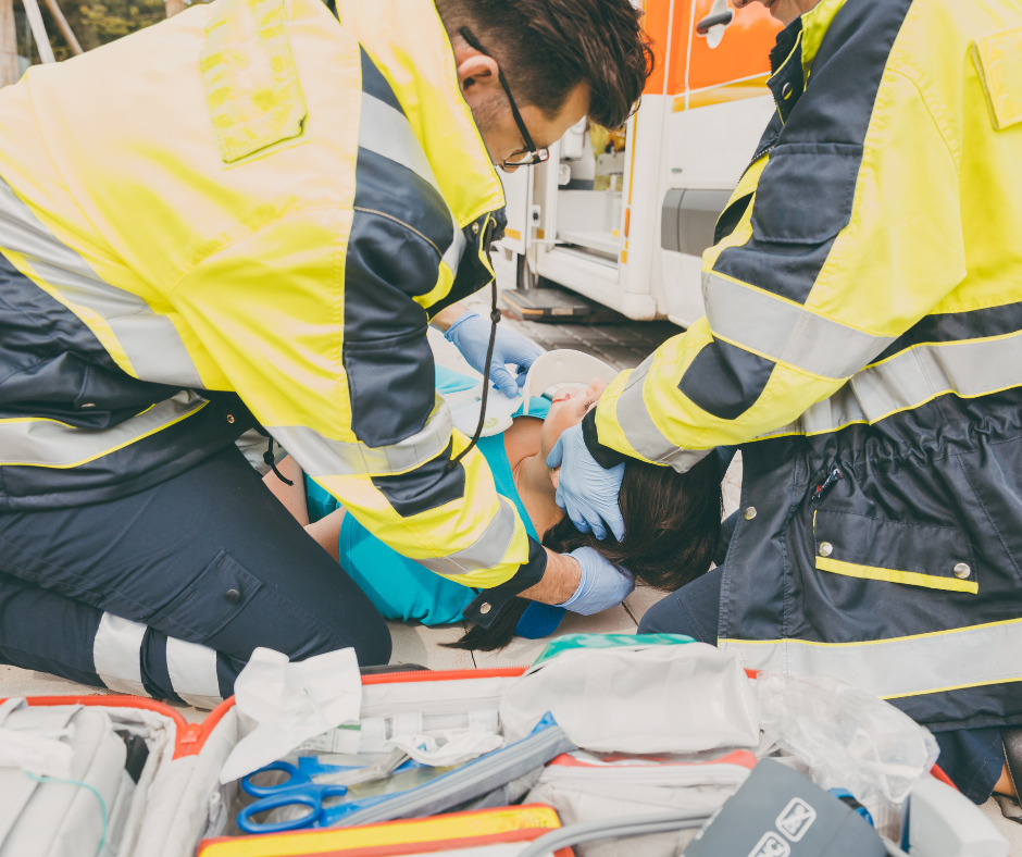 First responders helping an accident victim.